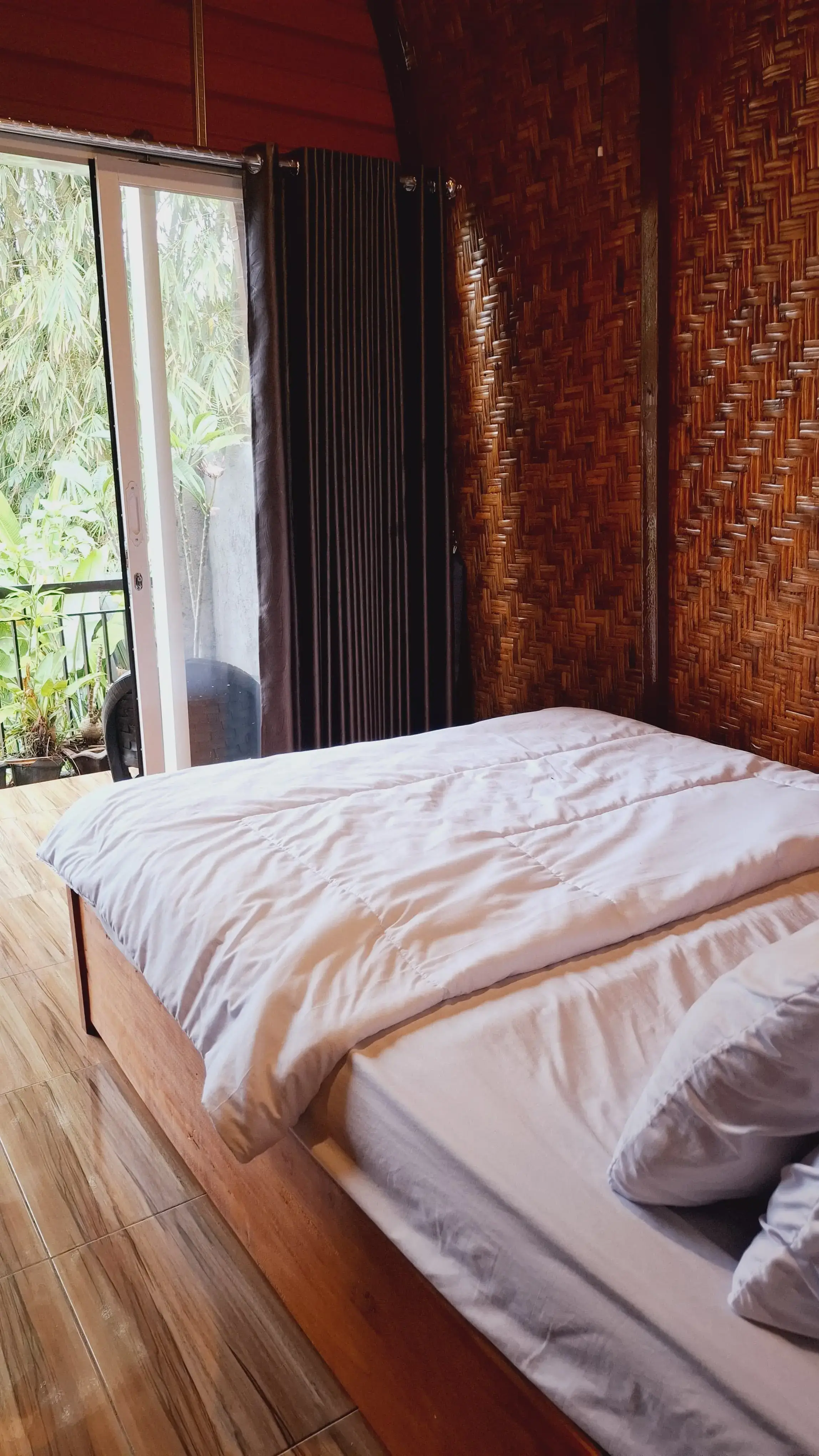 Bamboo Garden Suite bed detail with woven craft decor
